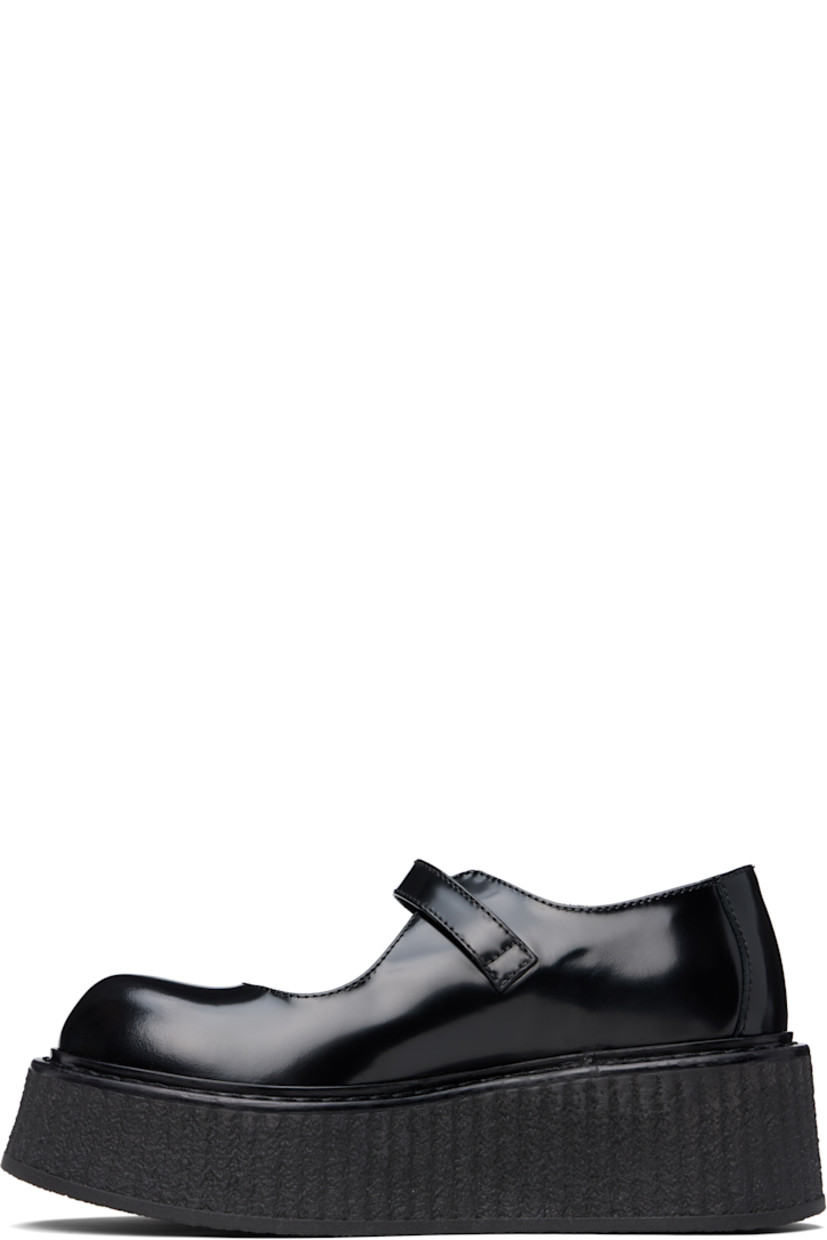 Buffed leather Mary Jane-style loafers in black.

· Pin-buckle strap at vamp
· Crêpe-rubber platform sole
· Platform: H2"

Supplier color: Black