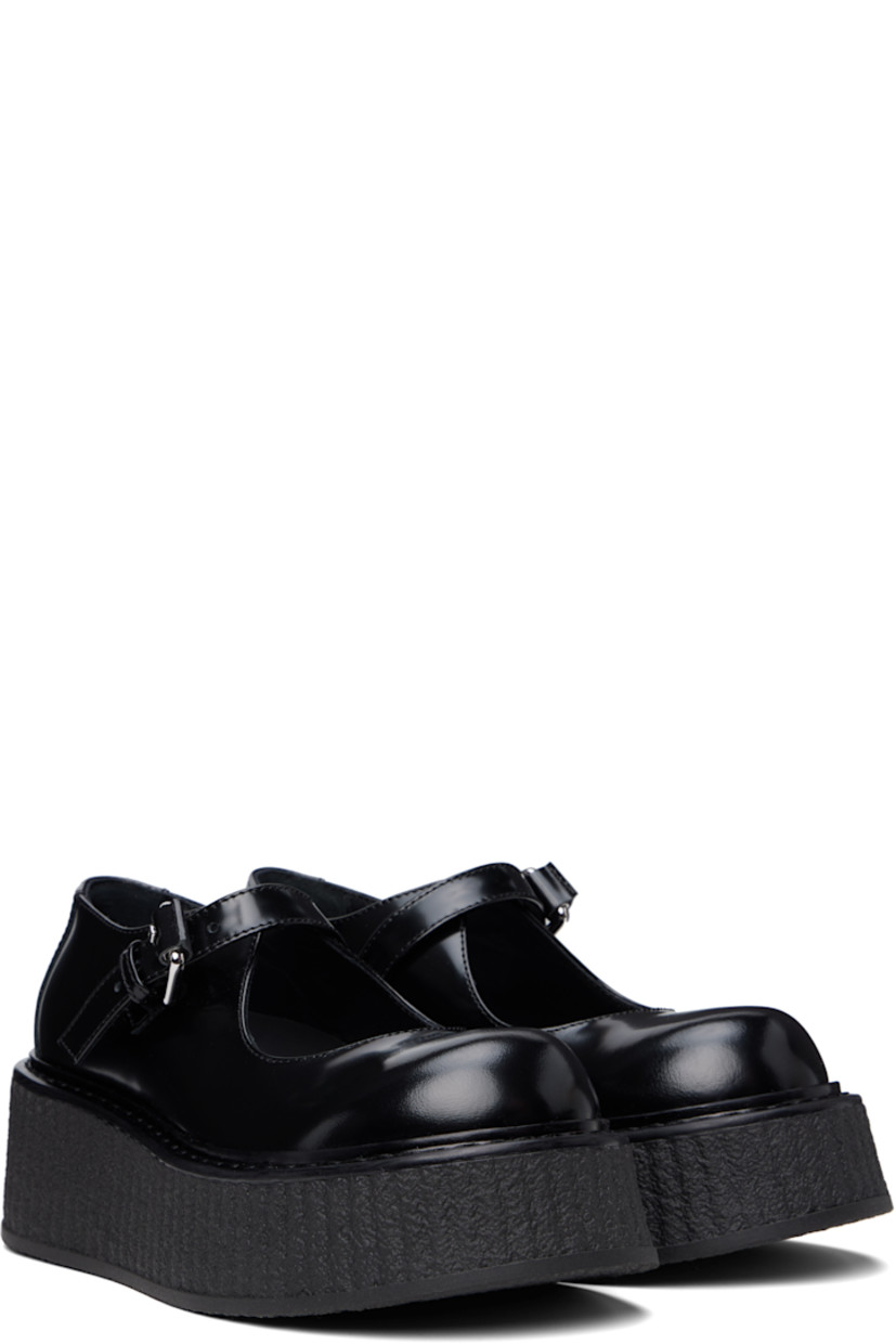 Buffed leather Mary Jane-style loafers in black.

· Pin-buckle strap at vamp
· Crêpe-rubber platform sole
· Platform: H2"

Supplier color: Black