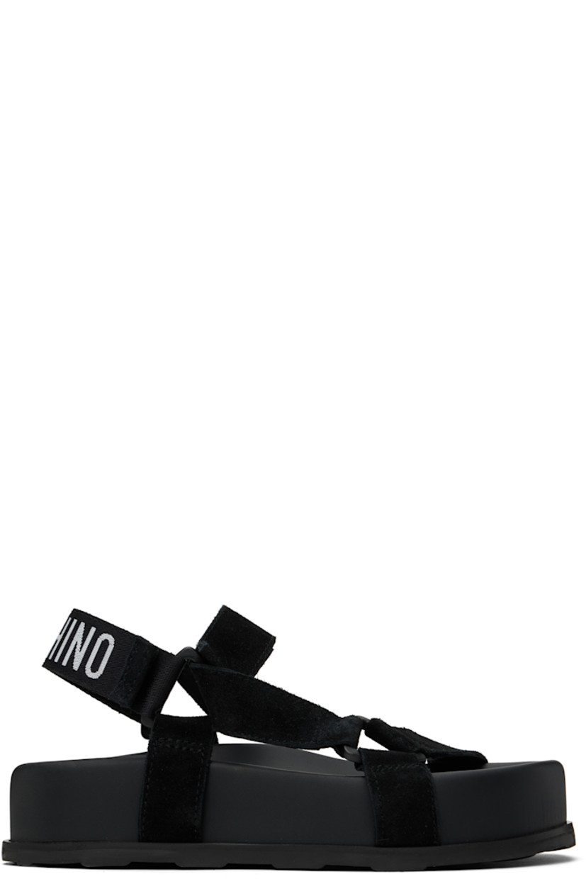 Calfskin suede sandals in black. 

· Open toe
· Strap at vamp
· Velcro ankle and slingback straps
· Jacquard logo at slingback strap
· Logo printed at molded footbed
· Platform midsole
· Treaded rubber sole
· Platform: H2"

Supplier color: Black