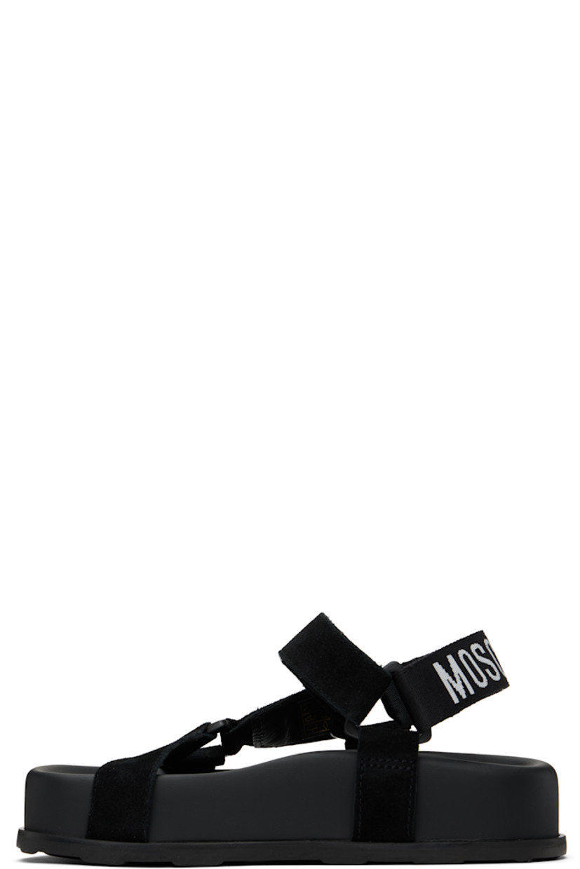 Calfskin suede sandals in black. 

· Open toe
· Strap at vamp
· Velcro ankle and slingback straps
· Jacquard logo at slingback strap
· Logo printed at molded footbed
· Platform midsole
· Treaded rubber sole
· Platform: H2"

Supplier color: Black