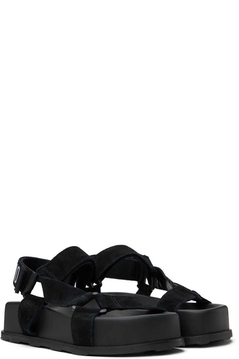 Calfskin suede sandals in black. 

· Open toe
· Strap at vamp
· Velcro ankle and slingback straps
· Jacquard logo at slingback strap
· Logo printed at molded footbed
· Platform midsole
· Treaded rubber sole
· Platform: H2"

Supplier color: Black
