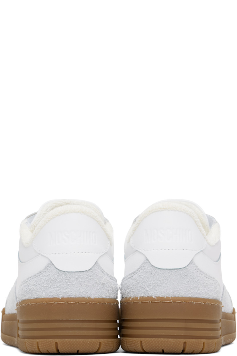Low-top buffed calfskin and suede sneakers in white and gray.

· Lace-up closure
· Logo embossed at padded tongue 
· Padded collar
· Logo embossed at heel tab
· Terrycloth lining
· Treaded rubber sole

Supplier color: White/White/White