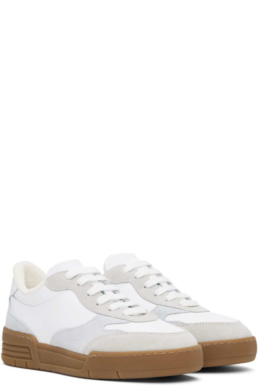 Low-top buffed calfskin and suede sneakers in white and gray.

· Lace-up closure
· Logo embossed at padded tongue 
· Padded collar
· Logo embossed at heel tab
· Terrycloth lining
· Treaded rubber sole

Supplier color: White/White/White