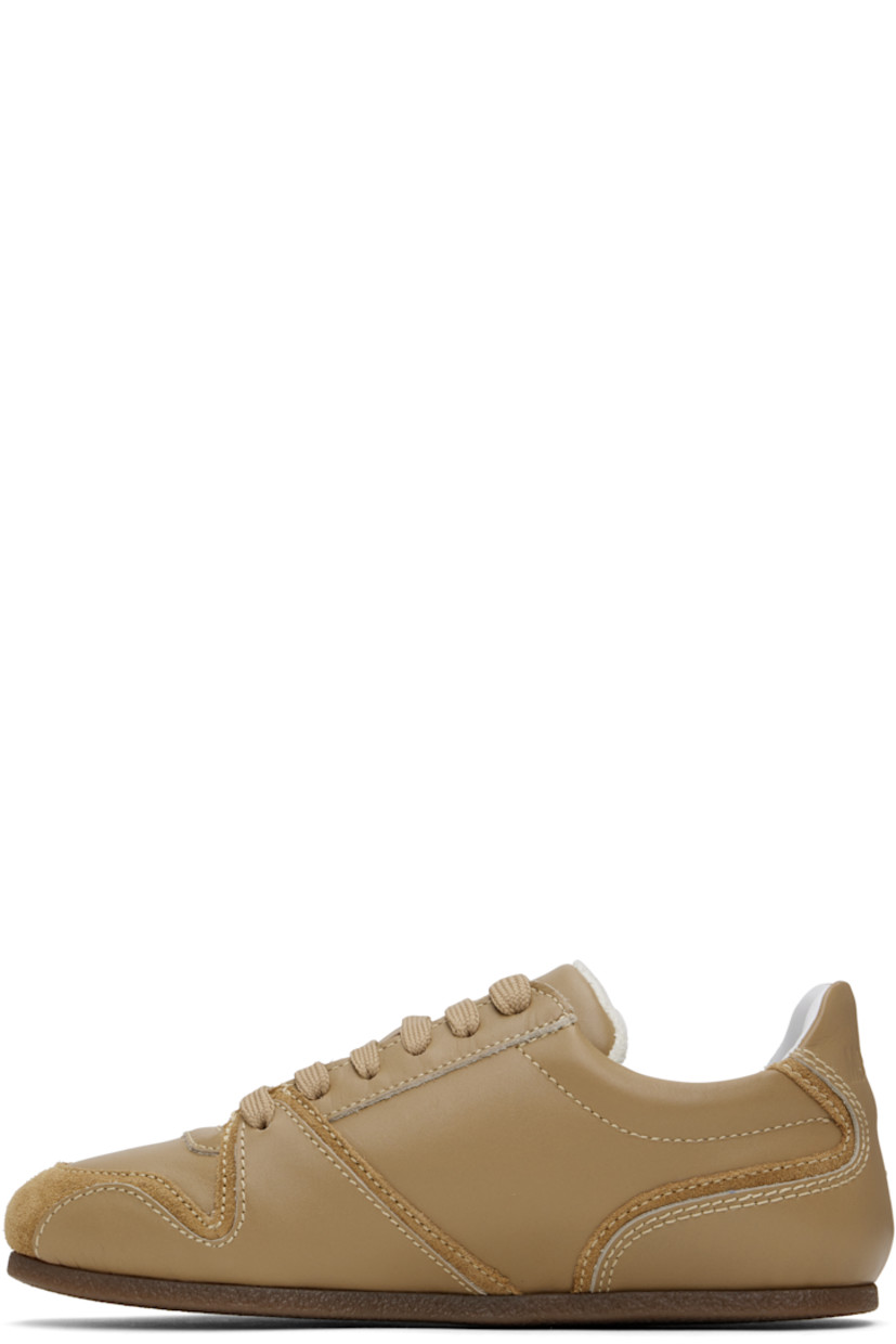 Low-top buffed calfskin and suede sneakers in taupe.

· Lace-up closure
· Logo embossed at padded tongue 
· Padded collar
· Logo embossed at heel tab
· Terrycloth lining
· Crêpe rubber sole

Supplier color: Beige/beige