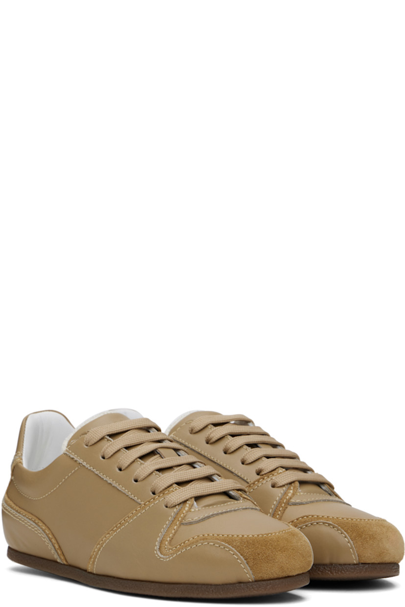 Low-top buffed calfskin and suede sneakers in taupe.

· Lace-up closure
· Logo embossed at padded tongue 
· Padded collar
· Logo embossed at heel tab
· Terrycloth lining
· Crêpe rubber sole

Supplier color: Beige/beige
