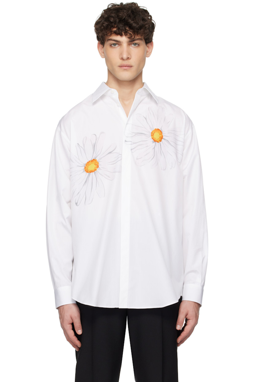 Cotton poplin shirt.

· Spread collar
· Concealed button closure
· Graphics printed at chest
· Logo embroidered at front
· Shirttail hem
· Dropped shoulders
· Pleats at single-button barrel cuffs
· Twin pleats at back yoke

Supplier color: Multi white