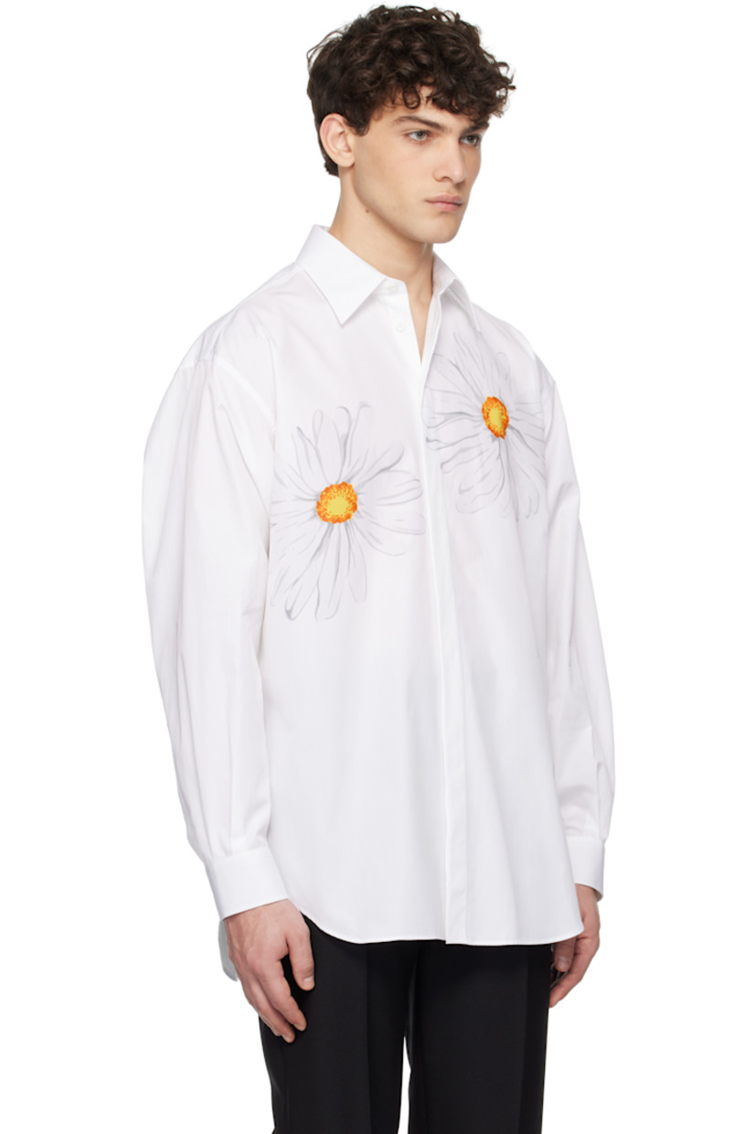 Cotton poplin shirt.

· Spread collar
· Concealed button closure
· Graphics printed at chest
· Logo embroidered at front
· Shirttail hem
· Dropped shoulders
· Pleats at single-button barrel cuffs
· Twin pleats at back yoke

Supplier color: Multi white