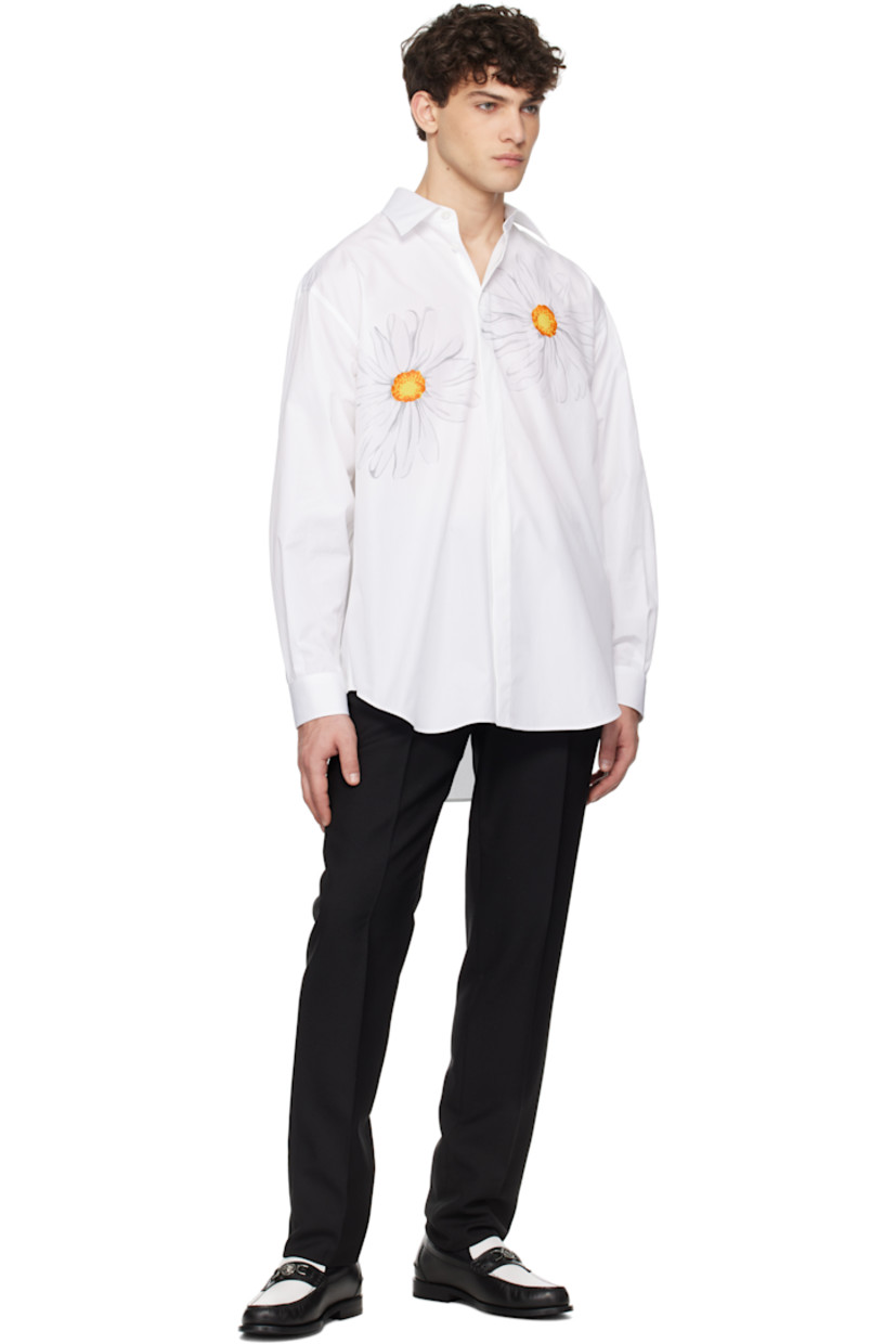 Cotton poplin shirt.

· Spread collar
· Concealed button closure
· Graphics printed at chest
· Logo embroidered at front
· Shirttail hem
· Dropped shoulders
· Pleats at single-button barrel cuffs
· Twin pleats at back yoke

Supplier color: Multi white