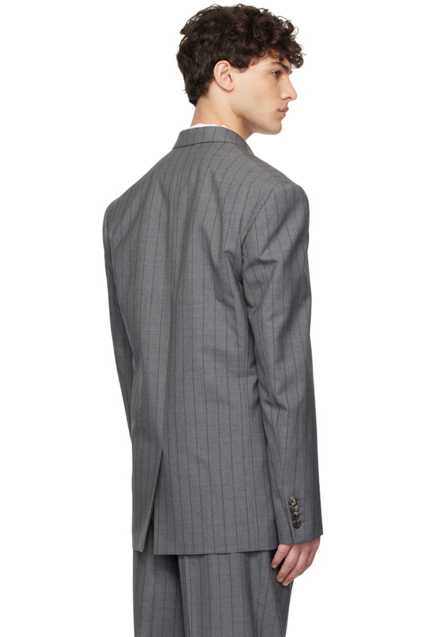 Plain-woven virgin wool blazer. Stripes throughout. 

· Notched lapel
· Button closure
· Welt pocket and flap pockets
· Padded shoulders
· Four-button surgeon's cuffs
· Vent at back hem
· Welt pockets at interior
· Fully lined

Supplier color: Multi grey