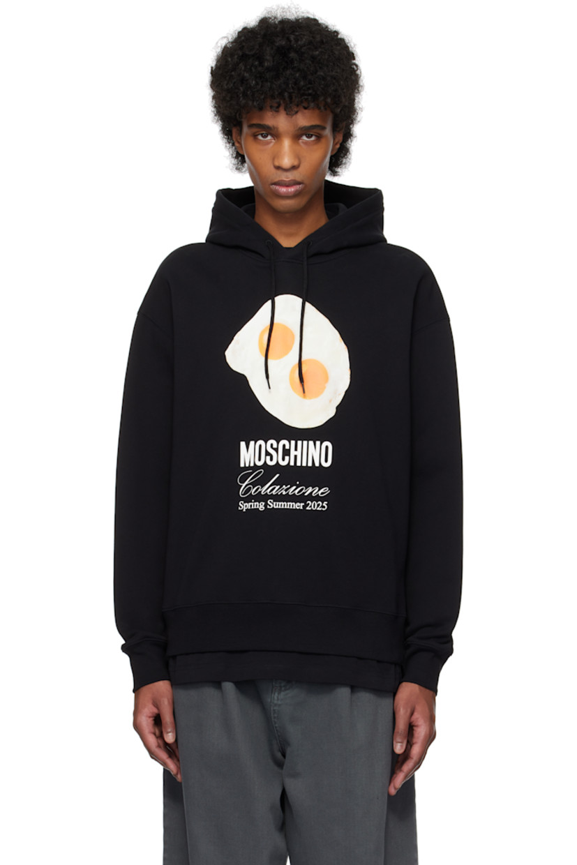 French terry hoodie. 

· Drawstring at hood
· Logo, graphic, and text printed at chest
· Rib-knit hem and cuffs 
· Dropped shoulders

Supplier color: Multi black