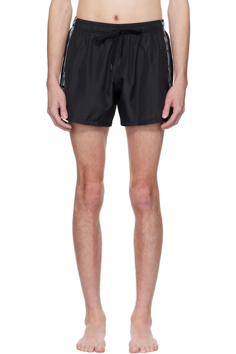 Polyester taffeta swim shorts.

· Drawstring at elasticized waistband
· Single-pocket styling
· Logo-woven trim at outseams
· Briefs-style mesh lining

Supplier color: Black