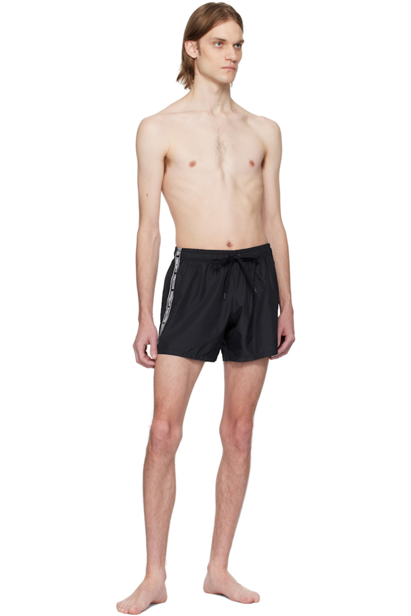 Polyester taffeta swim shorts.

· Drawstring at elasticized waistband
· Single-pocket styling
· Logo-woven trim at outseams
· Briefs-style mesh lining

Supplier color: Black
