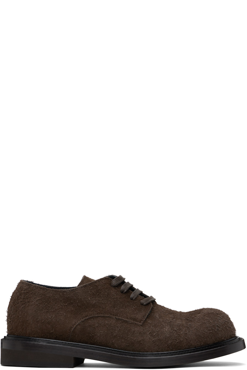 Calfskin suede derbys in brown.

· Lace-up closure
· Stacked leather and foam rubber block heel
�· Buffed calfskin lining
· Calfskin sole

Supplier color: Dark brown
