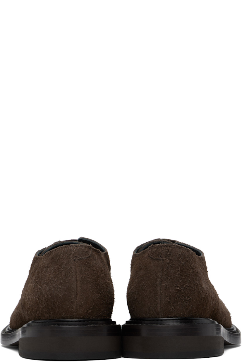 Calfskin suede derbys in brown.

· Lace-up closure
· Stacked leather and foam rubber block heel
· Buffed calfskin lining
· Calfskin sole

Supplier color: Dark brown