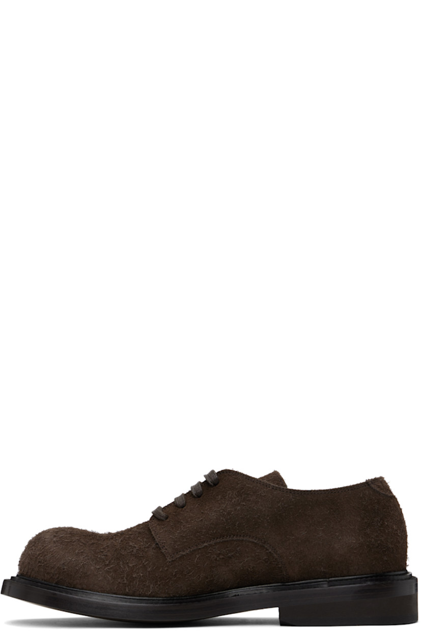 Calfskin suede derbys in brown.

· Lace-up closure
· Stacked leather and foam rubber block heel
· Buffed calfskin lining
· Calfskin sole

Supplier color: Dark brown