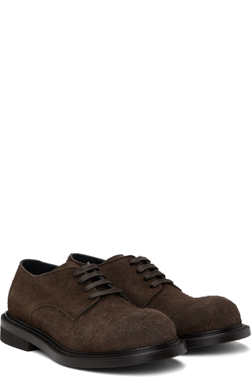 Calfskin suede derbys in brown.

· Lace-up closure
· Stacked leather and foam rubber block heel
· Buffed calfskin lining
· Calfskin sole

Supplier color: Dark brown