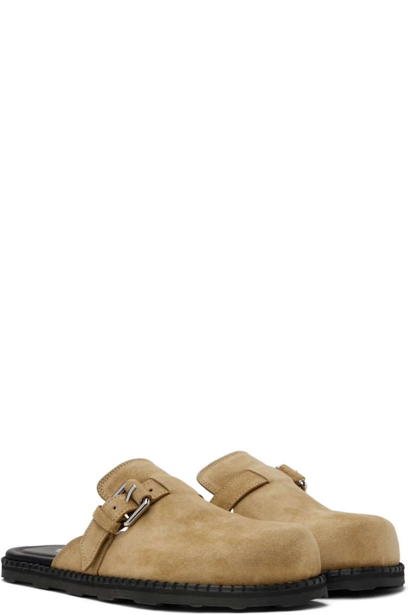 Calfskin suede slip-on loafers in beige. 

· Pin-buckle strap at vamp
· Logo printed at molded leather footbed
· Grained calfskin and sheepskin lining
· Treaded rubber sole

Supplier color: Beige