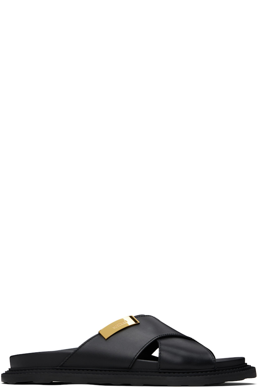 Buffed leather sandals in black.

· Open toe
· Crisscrossing straps at vamp
· Logo plaque at outer side
· Logo printed at molded footbed
· Topstitching at welt
· Treaded rubber sole

Supplier color: Black