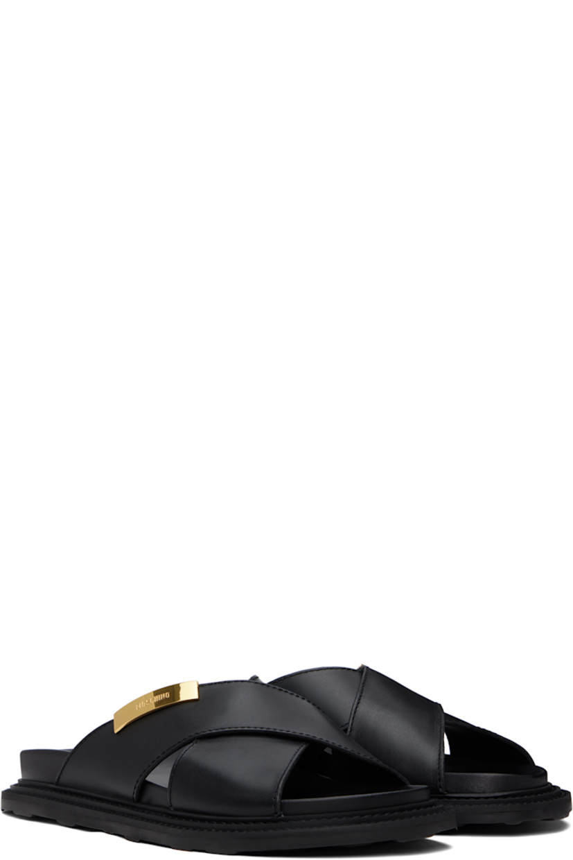 Buffed leather sandals in black.

· Open toe
· Crisscrossing straps at vamp
· Logo plaque at outer side
· Logo printed at molded footbed
· Topstitching at welt
· Treaded rubber sole

Supplier color: Black