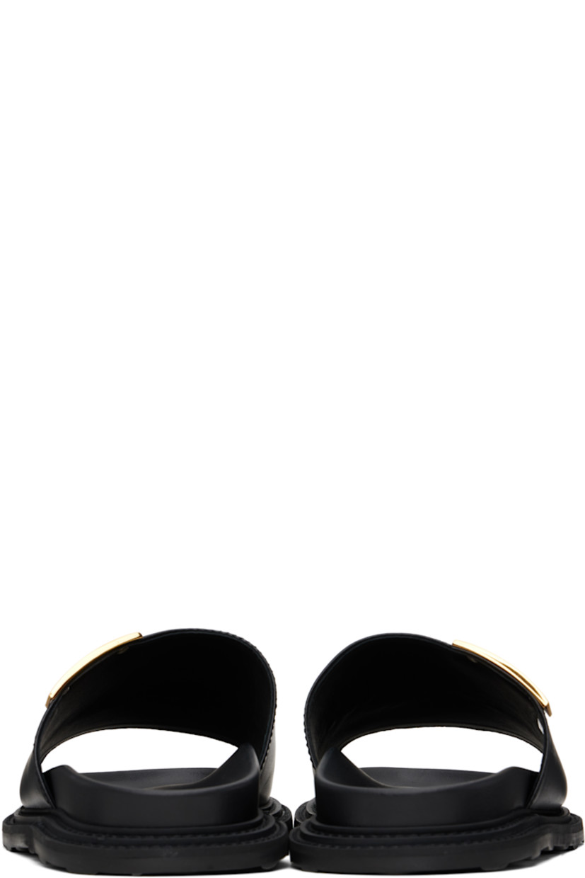 Grained calfskin sandals in black.

· Logo plaque at vamp
· Logo stamp at molded footbed
· Buffed calfskin lining
· Treaded rubber sole

Supplier color: Black