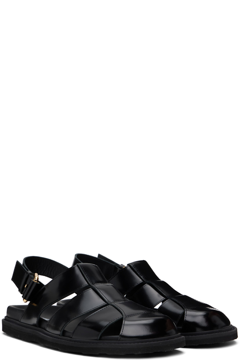 Polished calfskin sandals in black.

· Closed toe
· Pin-buckle ankle strap
· Logo stamp at molded footbed
· Grained calfskin lining
· Treaded rubber sole

Supplier color: Black