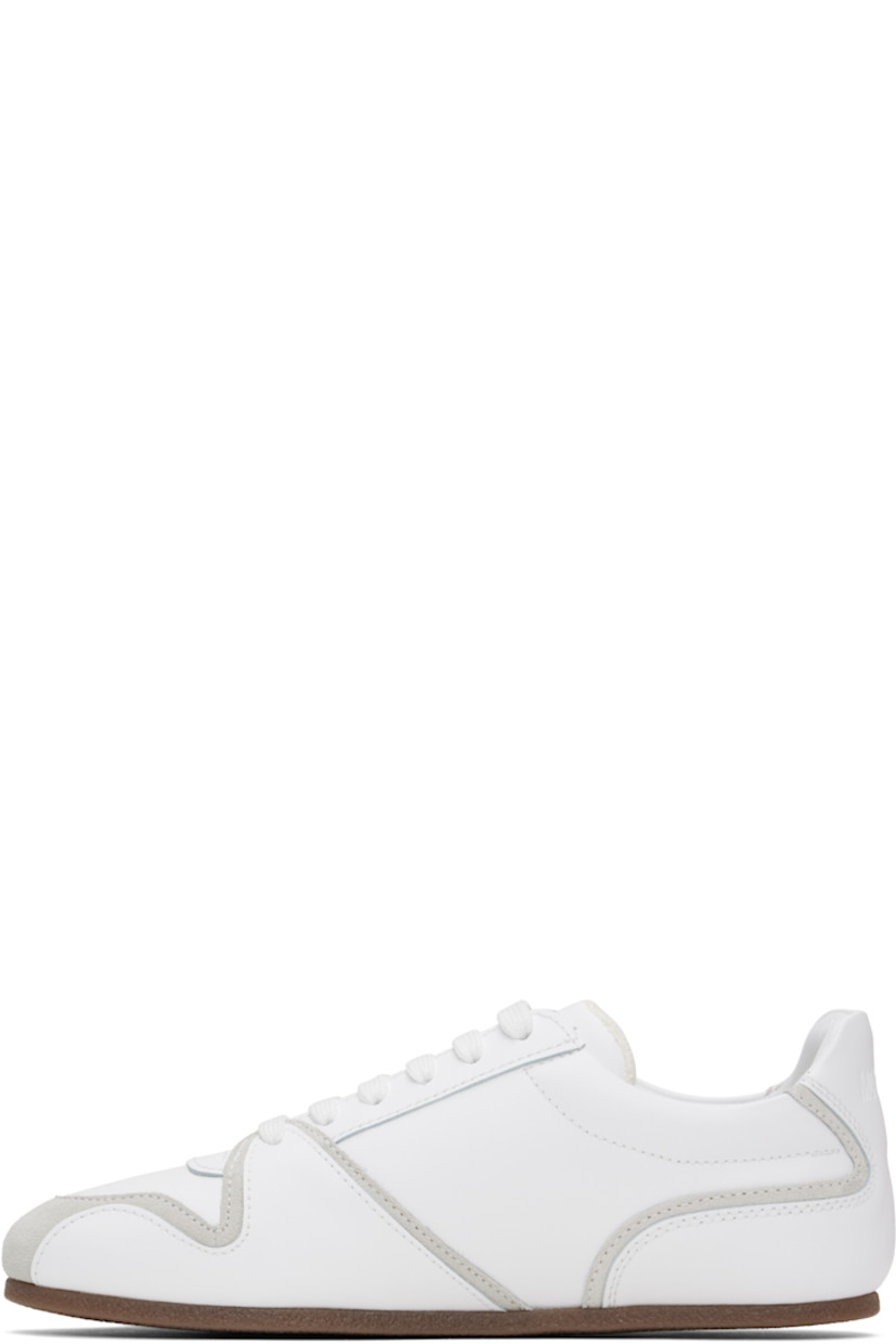 Low-top buffed calfskin and suede sneakers in white.

· Lace-up closure
· Logo embossed at padded tongue 
· Padded collar
· Logo embossed at heel tab
· Terrycloth lining
· Crêpe rubber sole

Supplier color: White/White