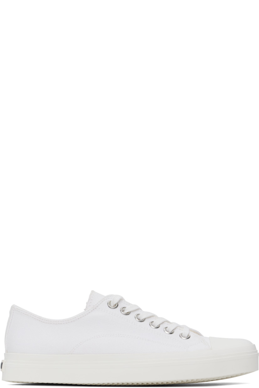 Low-top canvas sneakers in white.

· Square rubber cap toe
· Lace-up closure
· Twill lining
· Rubberized logo patch at heel
· Treaded rubber sole

Supplier color: White