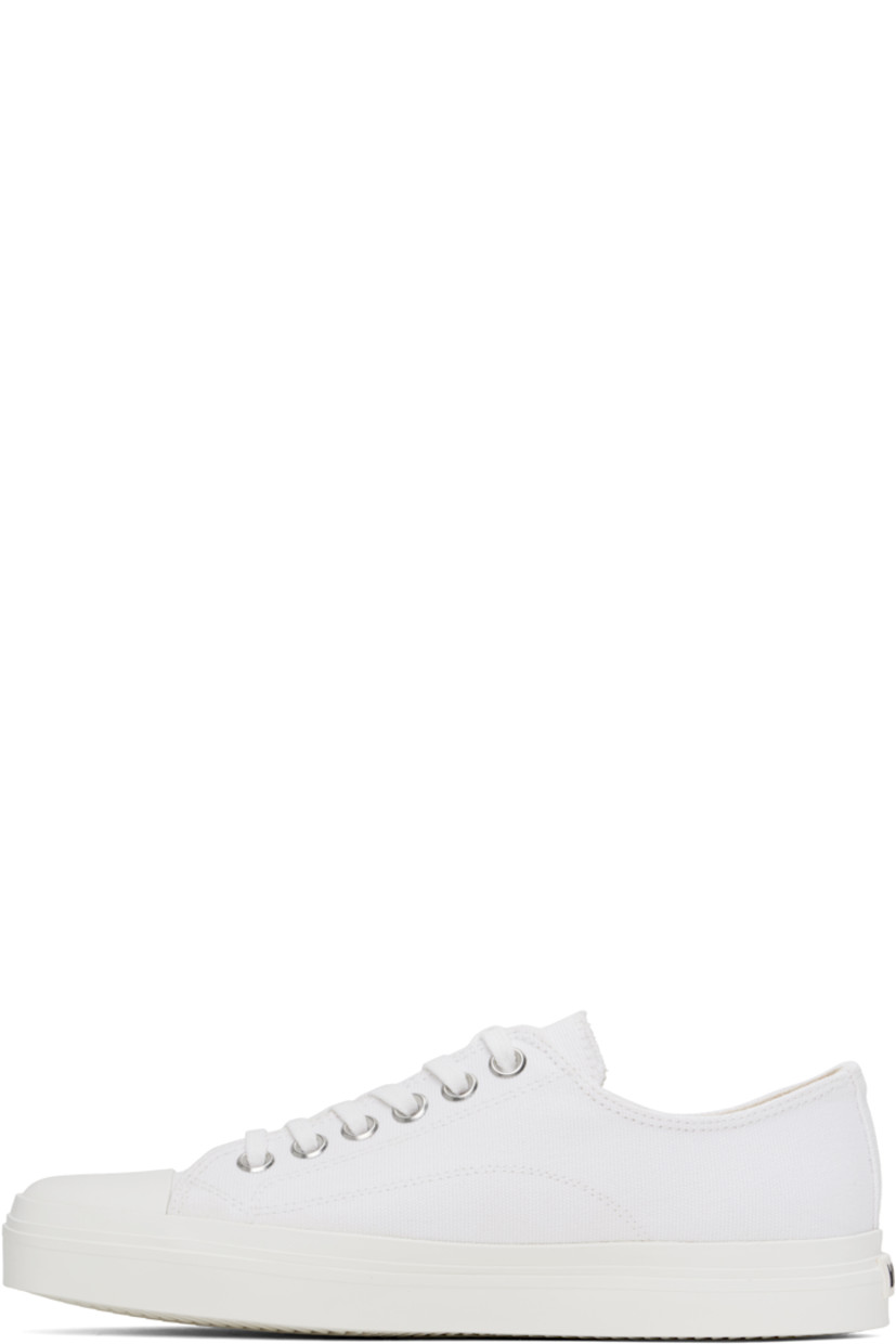 Low-top canvas sneakers in white.

· Square rubber cap toe
· Lace-up closure
· Twill lining
· Rubberized logo patch at heel
· Treaded rubber sole

Supplier color: White