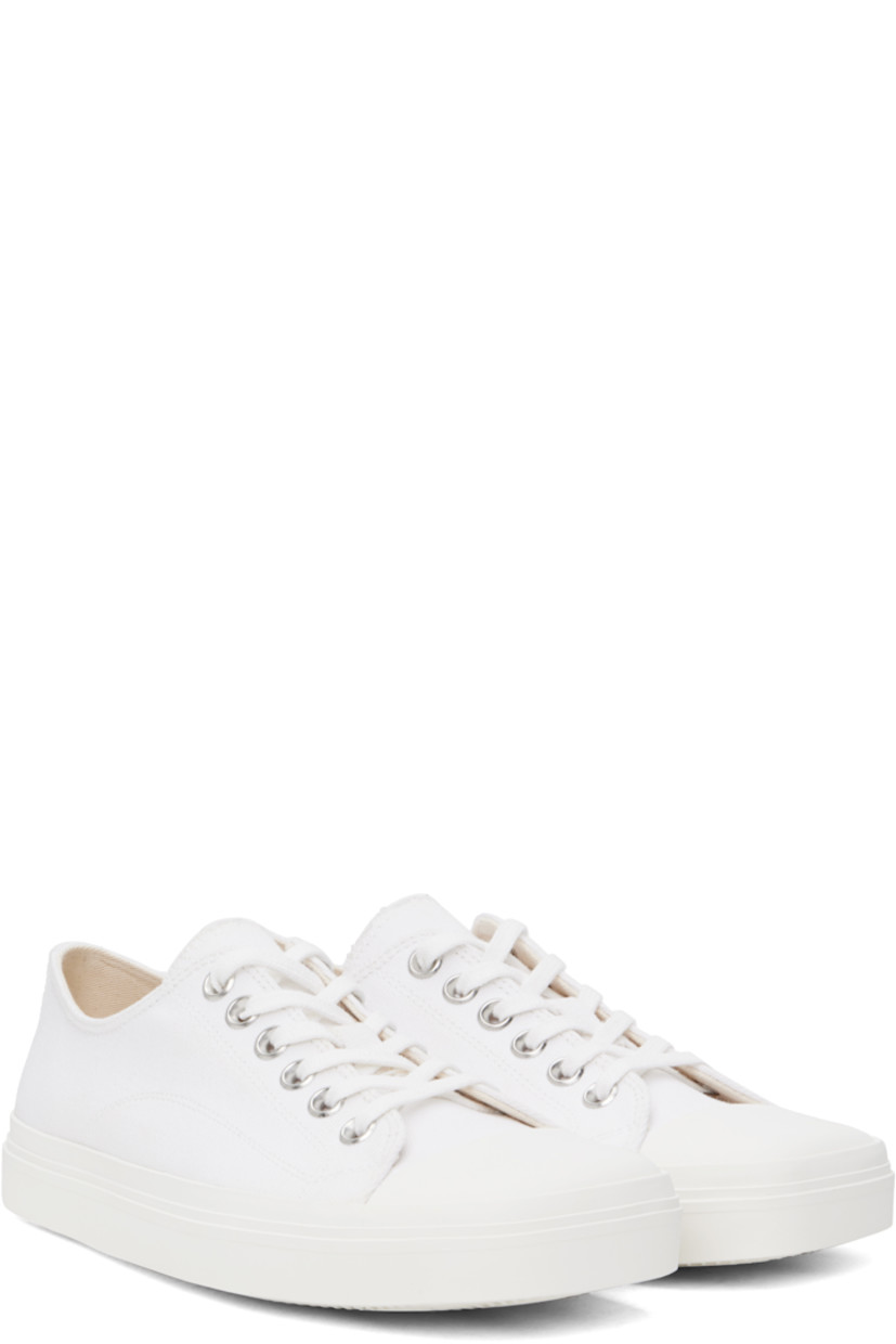Low-top canvas sneakers in white.

· Square rubber cap toe
· Lace-up closure
· Twill lining
· Rubberized logo patch at heel
· Treaded rubber sole

Supplier color: White