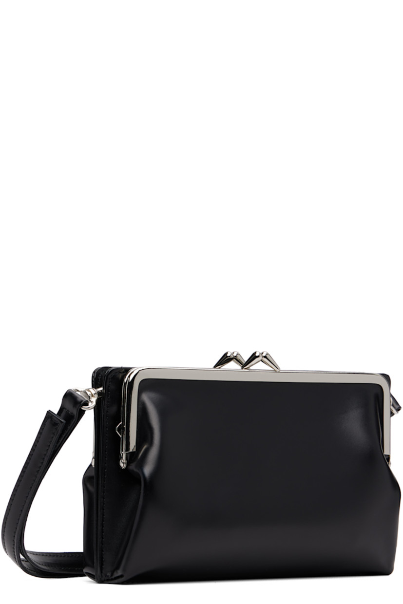 Buffed leather shoulder bag.

· Three-compartment construction
· Adjustable and detachable crossbody strap
· Kiss-lock and magnetic press-stud closure
· Four card slots at interior
· Buffed leather lining
· H5.25" x W7" x D2.5"

Supplier color: Black