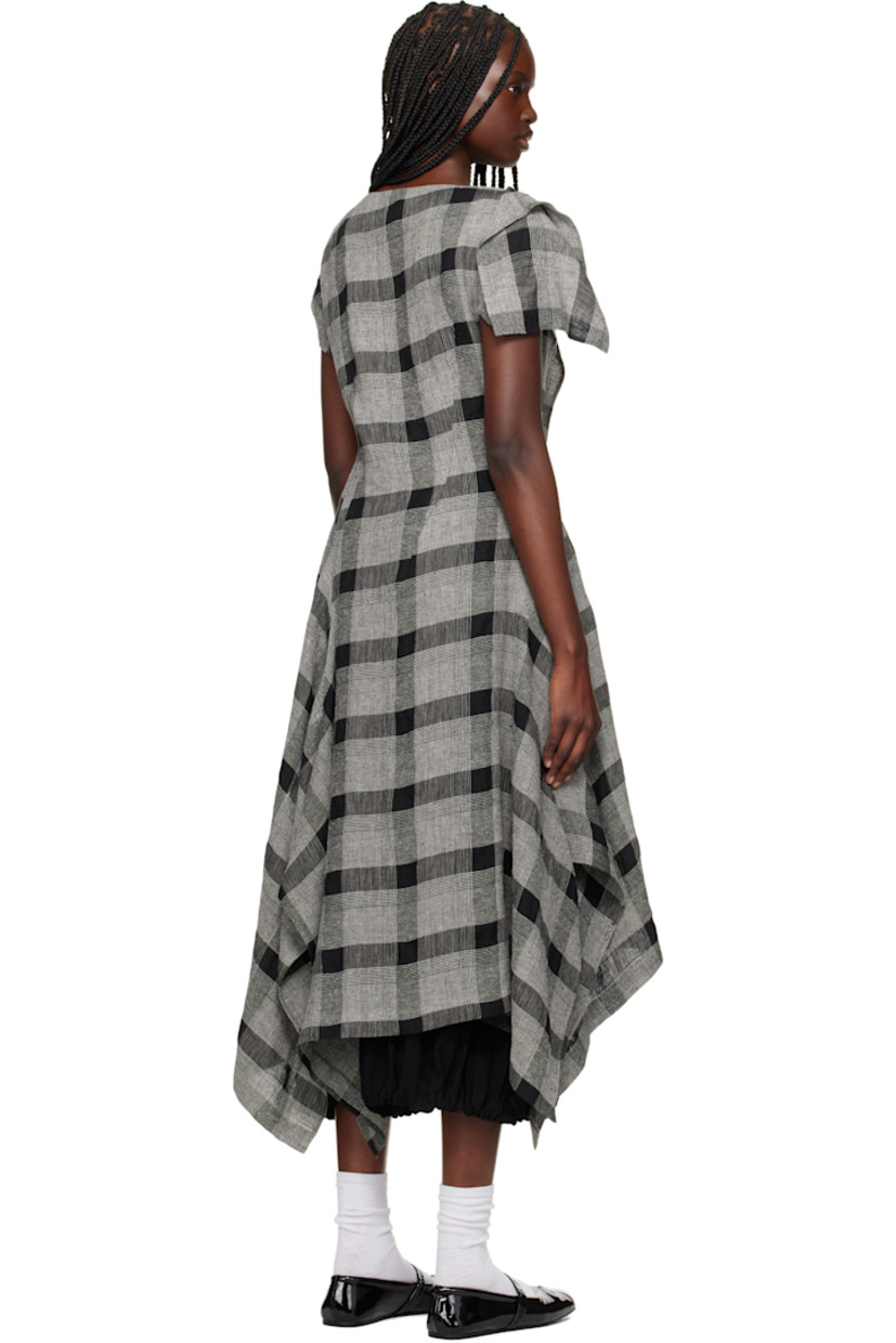 Linen- and silk-blend hopsack midi dress. Check pattern throughout.

· Asymmetrical construction
· Boatneck
· Welt pocket at front
· Zip closure at side seam
· Vented cap sleeves

Supplier color: Black