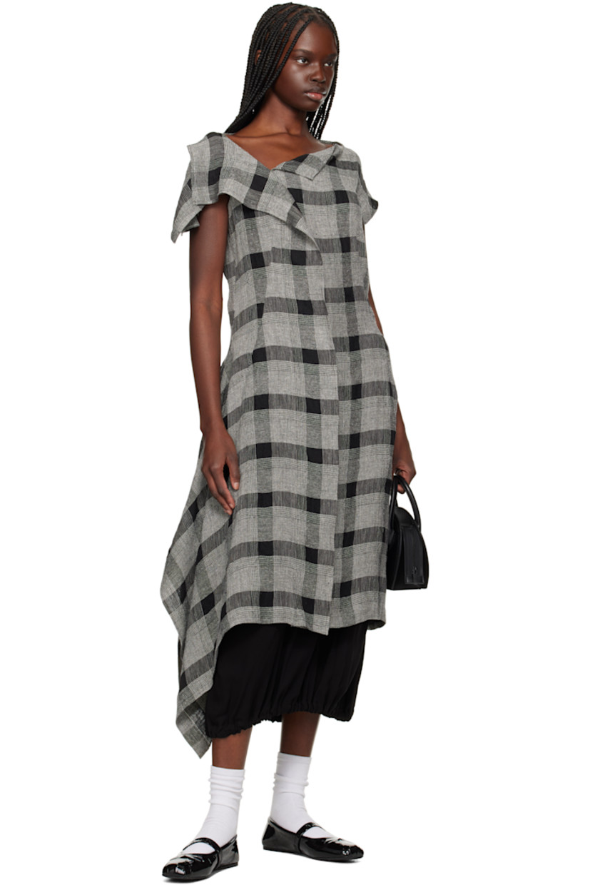 Linen- and silk-blend hopsack midi dress. Check pattern throughout.

· Asymmetrical construction
· Boatneck
· Welt pocket at front
· Zip closure at side seam
· Vented cap sleeves

Supplier color: Black