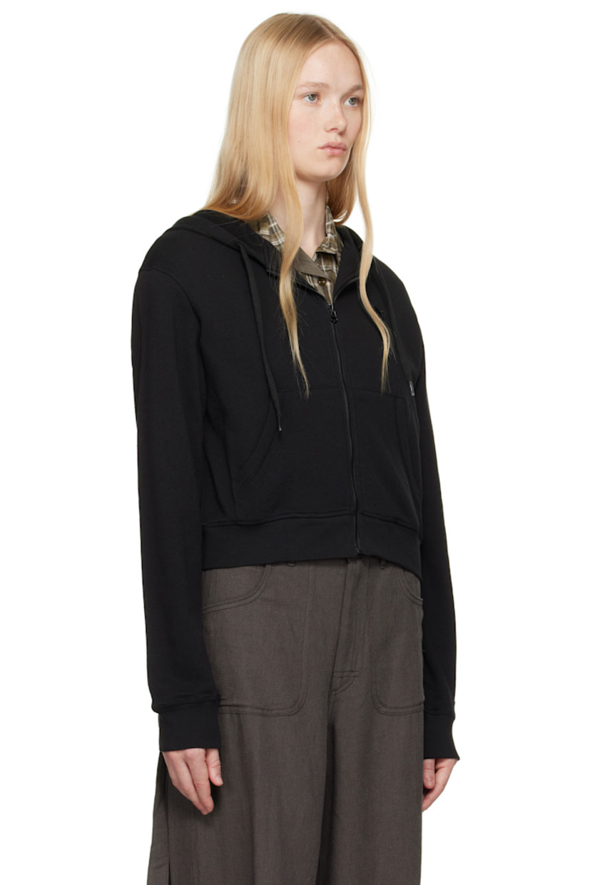 French terry hoodie. 

· Drawstring at hood
· Zip closure
· Logo graphic embroidered at chest
· Patch pockets
· Rib-knit cropped hem and cuffs

Supplier color: Black
