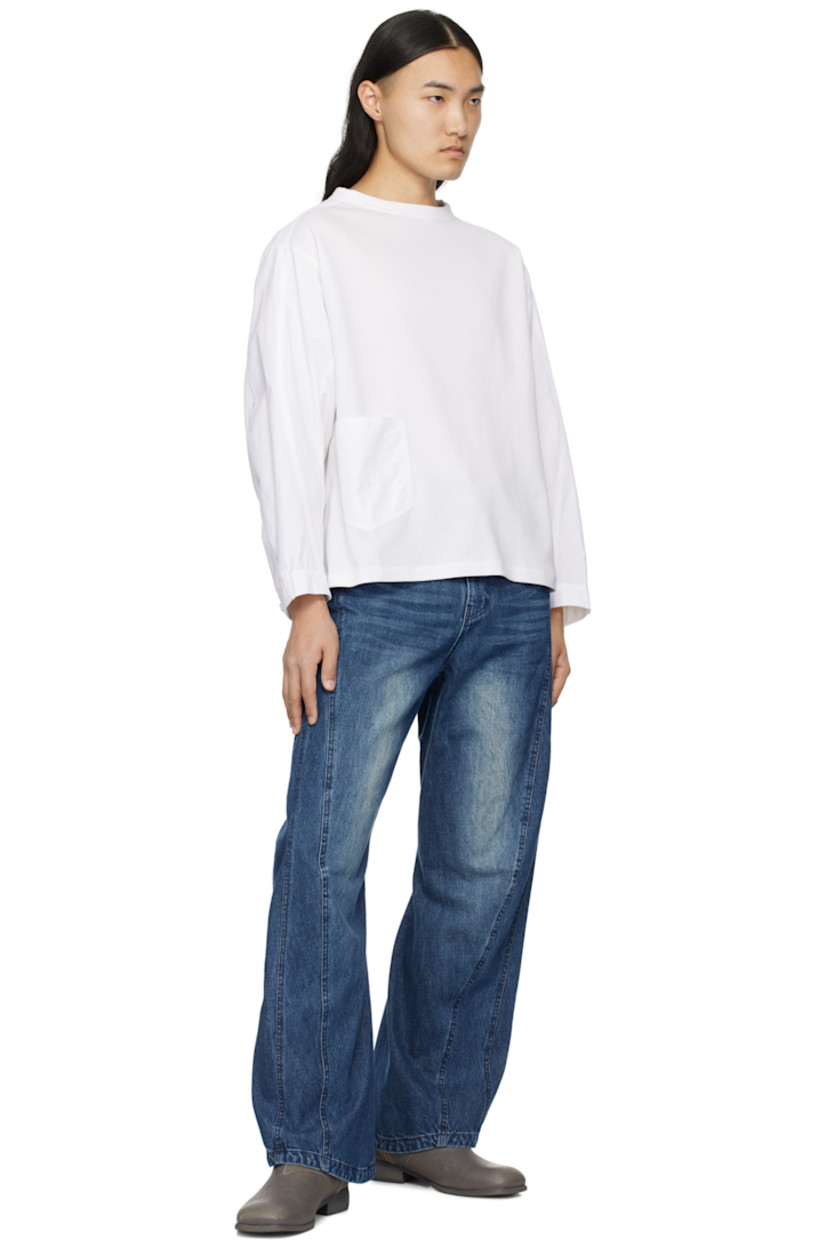 Nylon-blend poplin and cotton-blend jersey T-shirt.

· Paneled construction
· Crewneck
· Patch pocket at front
· Curved seam at sleeves
· Adjustable single-button cuffs
· Locker loop at back collar
· Pleats at back yoke

Supplier color: White