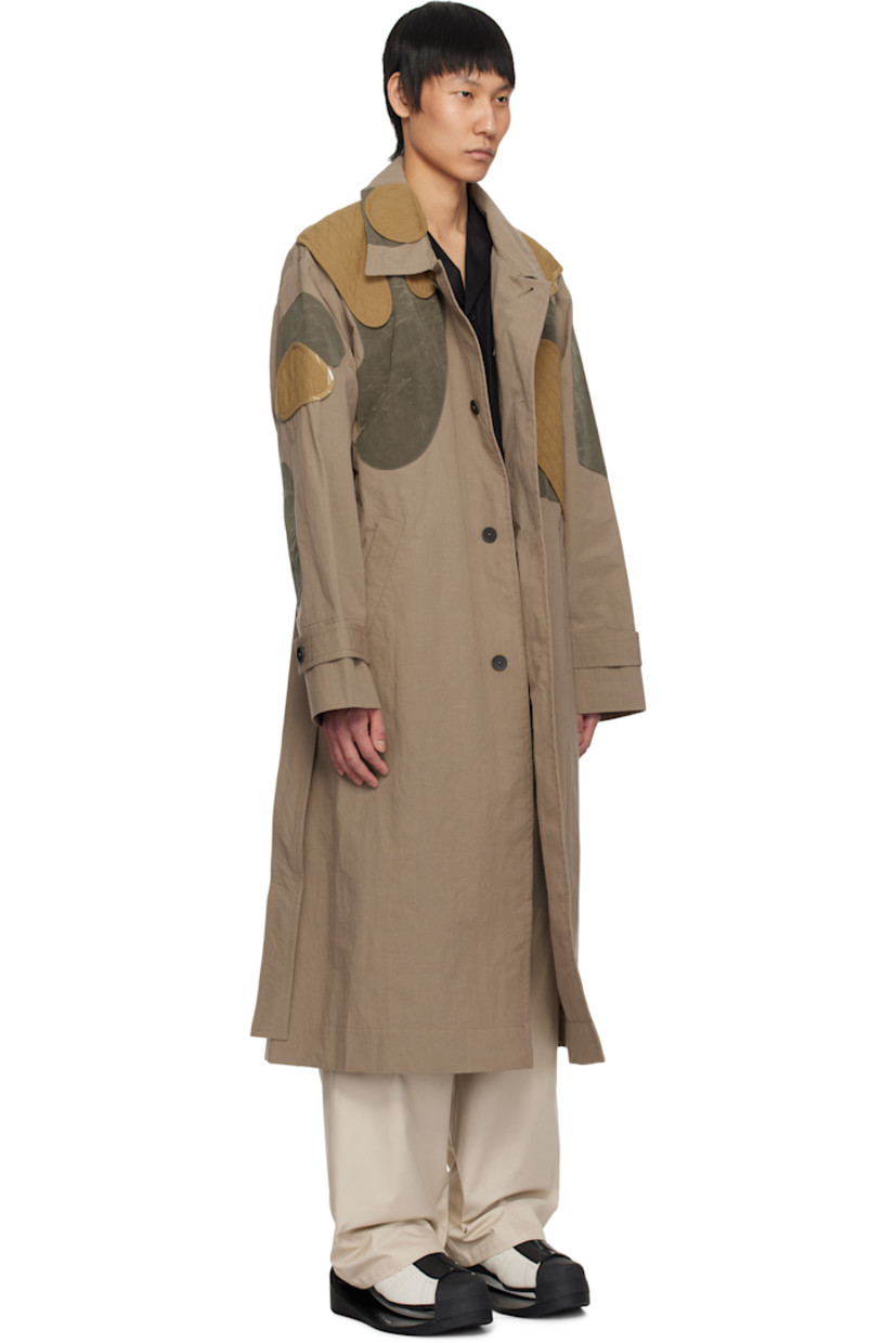 Cotton-blend poplin trench coat. Quilted patches throughout.

· Paneled construction
· Spread collar
· Button closure
· Belt loops and detachable self-tie belt
· Welt pockets
· Adjustable button tab at cuffs
· Zip pocket at interior
· Unlined

Supplier color: Beige