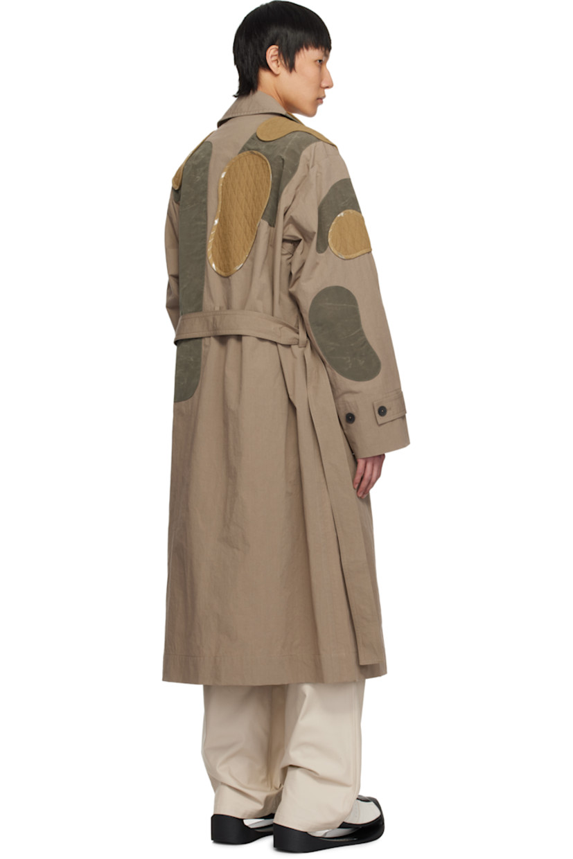 Cotton-blend poplin trench coat. Quilted patches throughout.

· Paneled construction
· Spread collar
· Button closure
· Belt loops and detachable self-tie belt
· Welt pockets
· Adjustable button tab at cuffs
· Zip pocket at interior
· Unlined

Supplier color: Beige