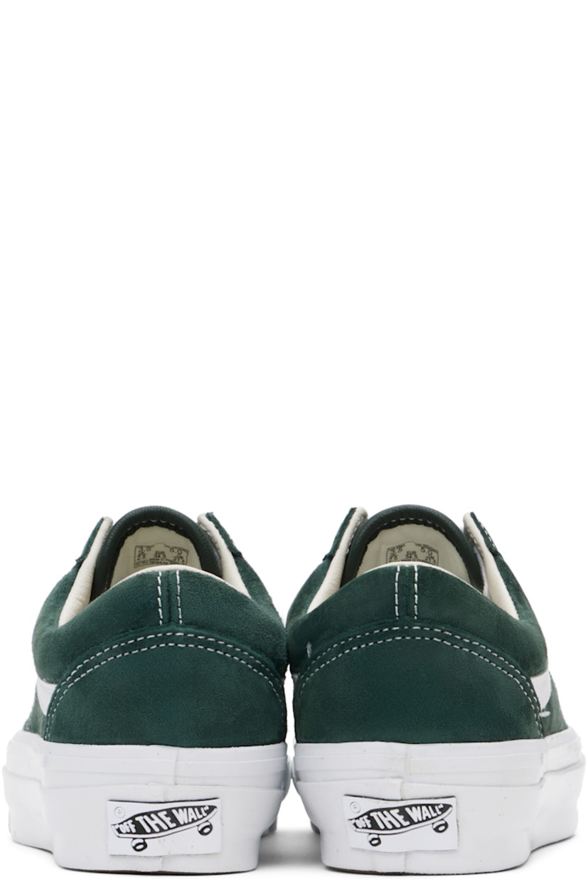 Low-top pigskin suede sneakers in green.

· Lace-up closure
· Padded tongue and collar
· Grained leather Sidestripe™ at sides
· Padded Sola ADC foam footbed
· Buffed leather and canvas lining
· Rubberized logo patch at heel
· Treaded rubber sole
· Contrast stitching in white

Supplier color: Scarab