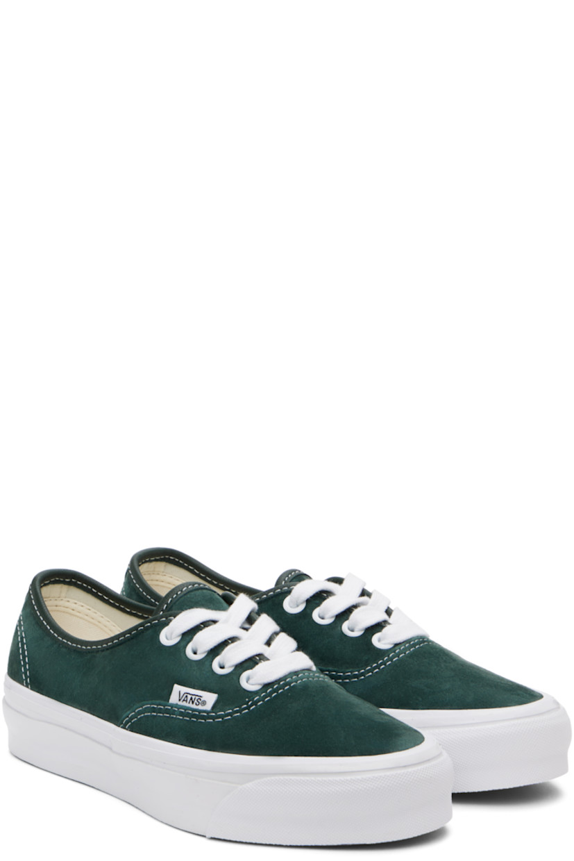 Low-top pigskin suede sneakers in green.

· Lace-up closure
· Logo flag at outer side
· Padded Sola ADC foam footbed
· Canvas lining
· Rubberized logo patch at heel
· Treaded rubber sole
· Contrast stitching in white

Supplier color: Scarab