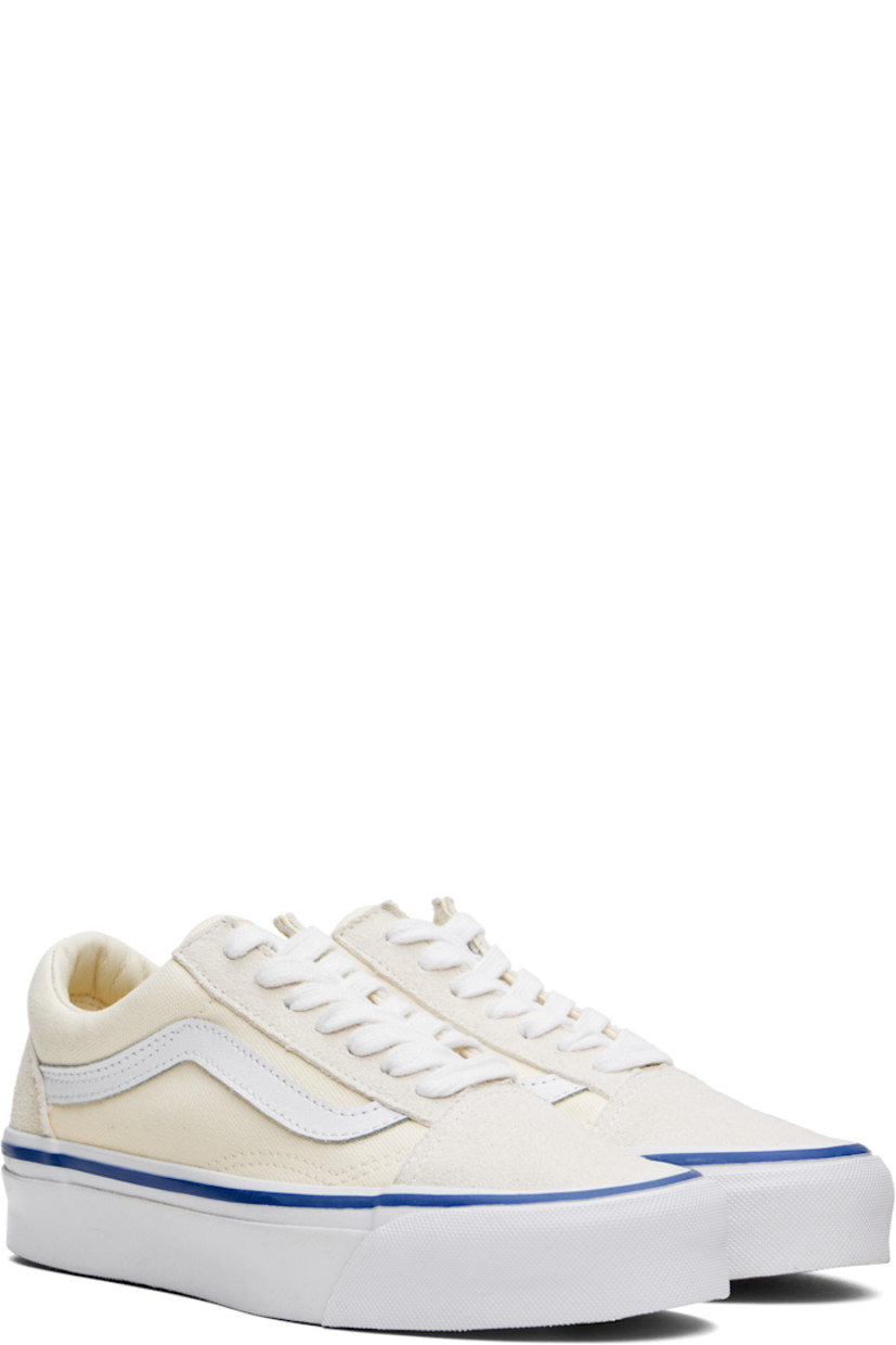 Low-top 8 oz canvas and suede sneakers in off-white.

· Lace-up closure
· Padded tongue and collar
· Grained leather Sidestripe™ at sides
· Padded Sola ADC foam footbed
· Grained leather and canvas lining
· Rubberized logo patch at heel
· Treaded rubber sole
· Contrast stitching in white

Supplier color: Lx off-white