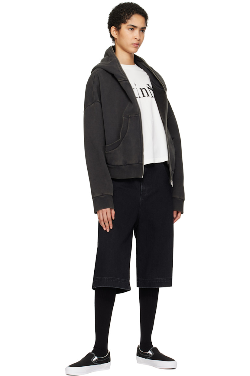 Low-top slip-on canvas sneakers in black. 

· Elasticized gussets at tongue
· Padded collar
· Logo flag at outer side
· Padded Sola ADC foam footbed
· Grained leather and canvas lining
· Rubberized logo patch at heel
· Treaded rubber sole
· Contrast stitching in white

Supplier color: Black/White