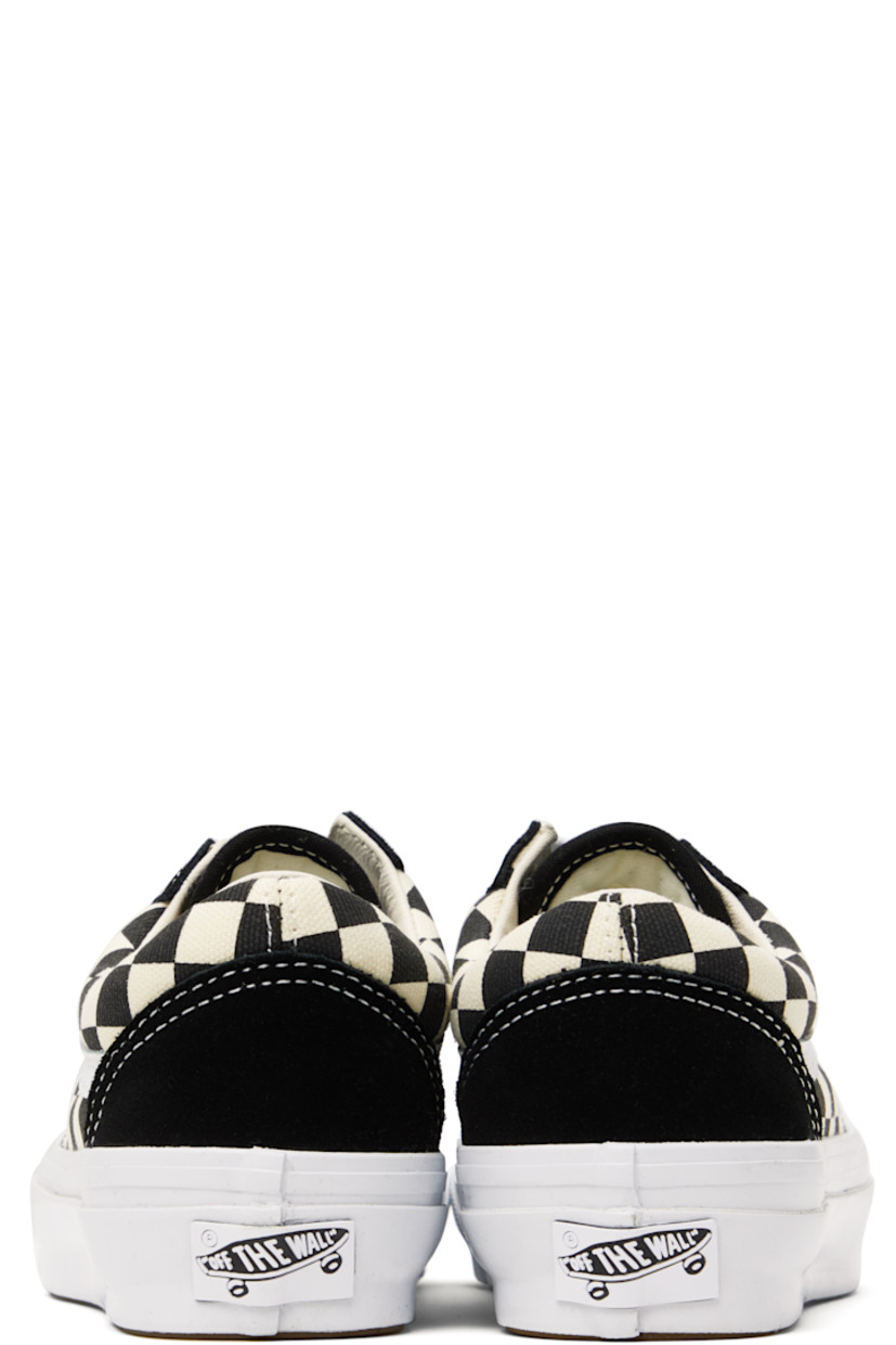 Low-top canvas and suede sneakers in black and off-white. Check pattern printed throughout.

· Lace-up closure
· Padded tongue and collar
· Grained leather Sidestripe™ at sides
· Rubberized logo patch at heel
· Removable padded foam insole
· Treaded rubber sole
· Contrast stitching in white

Supplier color: LX checkerboard black/Off
