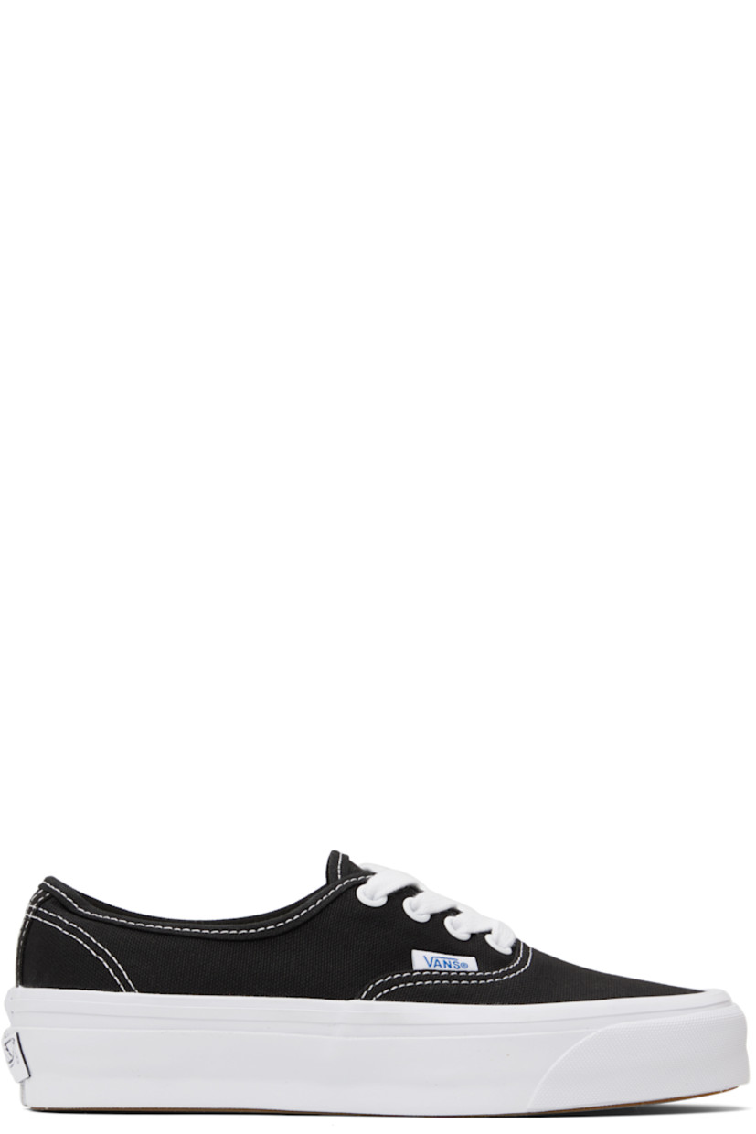 Low-top canvas sneakers in black.

· Lace-up closure
· Logo flag at outer side
· Rubberized logo patch at heel
· Removable padded Sola ADC foam footbed
· Textured rubber midsole
· Treaded rubber sole
· Contrast stitching in white 

Supplier color: LX black/White
