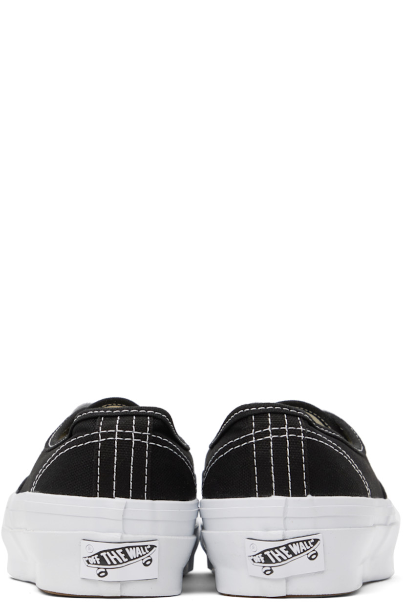 Low-top canvas sneakers in black.

· Lace-up closure
· Logo flag at outer side
· Rubberized logo patch at heel
· Removable padded Sola ADC foam footbed
· Textured rubber midsole
· Treaded rubber sole
· Contrast stitching in white 

Supplier color: LX black/White