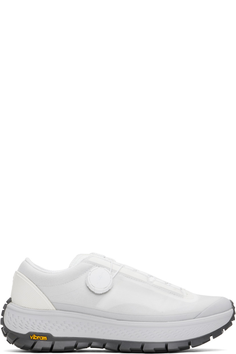 Low-top Dyneema® ripstop sneakers in white.

· Lightweight and breathable
· FIDLOCK® lace-up closure
· Logo bonded at padded tongue
· Padded collar
· Logo embossed at rubberized heel counter
· Mesh and suede lining
· Textured rubber midsole
· Treaded Vibram® rubber sole

Supplier color: White/Grey
