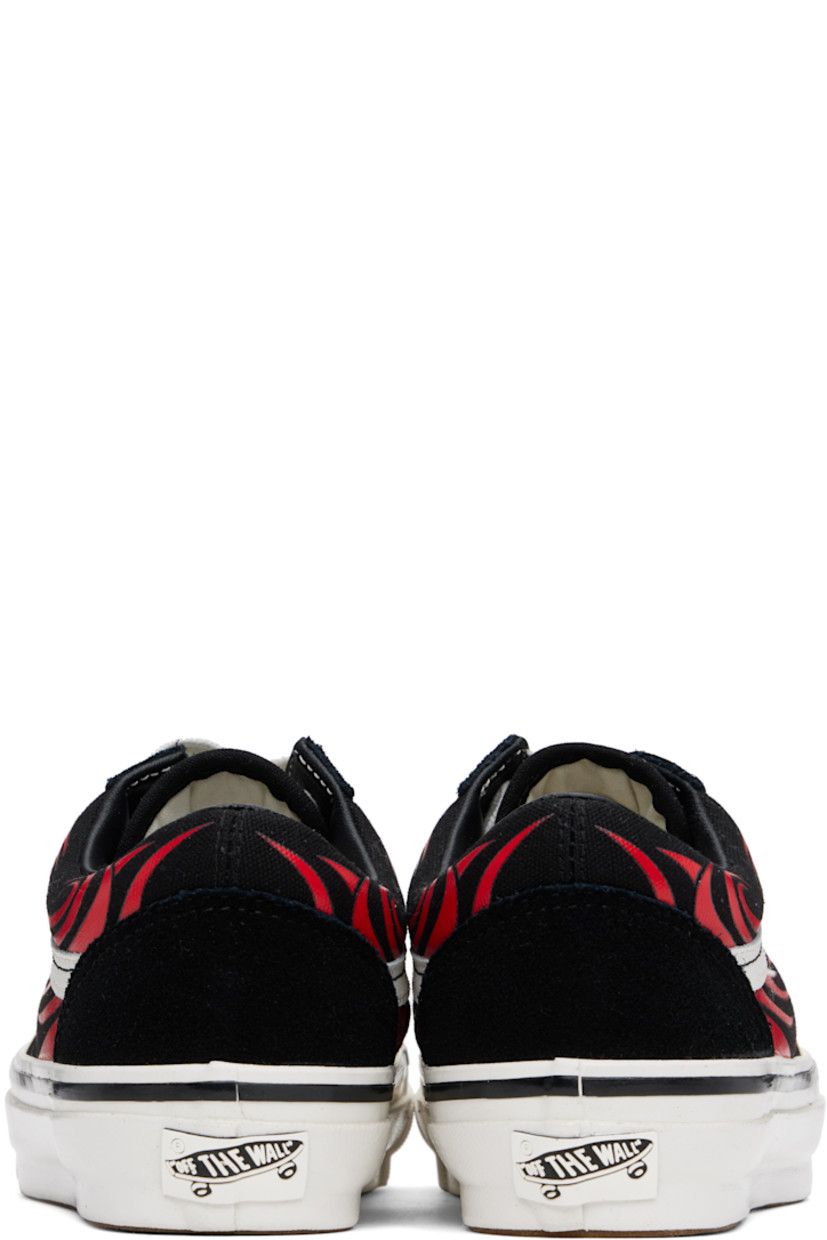 Low-top suede and canvas sneakers in black.

· Graphic pattern printed throughout
· Lace-up closure
· Padded tongue and collar
· Grained leather Sidestripe™ at sides
· Rubberized logo patch at heel
· Removable cushioned Sola ADC foam footbed
· Grained leather and canvas lining
· Treaded rubber sole

Supplier color: Y2K flame black/White