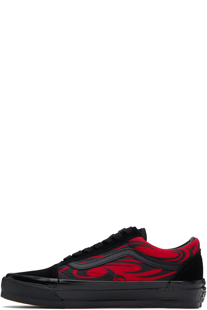 Low-top suede and 8 oz canvas sneakers in black and red. 

· Graphic pattern printed throughout
· Lace-up closure
· Padded tongue and collar
· Grained leather Sidestripe™ at sides
· Rubberized logo patch at heel
· Removable cushioned Sola ADC foam footbed
· Grained leather and canvas lining
· Treaded rubber sole

Supplier color: Black/Red