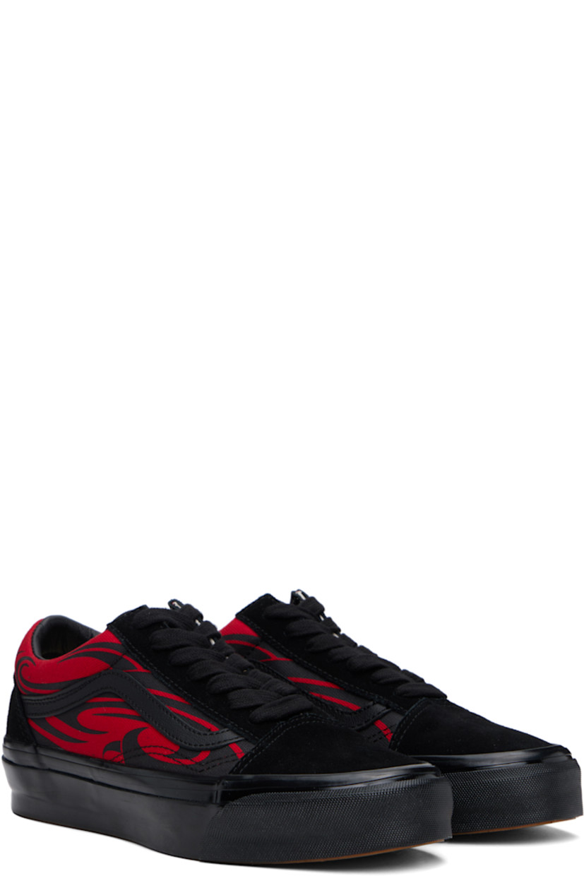 Low-top suede and 8 oz canvas sneakers in black and red. 

· Graphic pattern printed throughout
· Lace-up closure
· Padded tongue and collar
· Grained leather Sidestripe™ at sides
· Rubberized logo patch at heel
· Removable cushioned Sola ADC foam footbed
· Grained leather and canvas lining
· Treaded rubber sole

Supplier color: Black/Red
