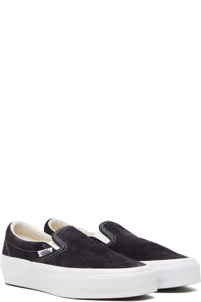 Low-top pigskin suede slip-on sneakers in navy.

· Elasticized gussets at vamp
· Padded collar
· Logo flag at outer side
· Rubberized logo patch at heel
· Grained leather and canvas lining
· Treaded rubber sole
· Contrast stitching in white

Supplier color: Pig suede nine iron