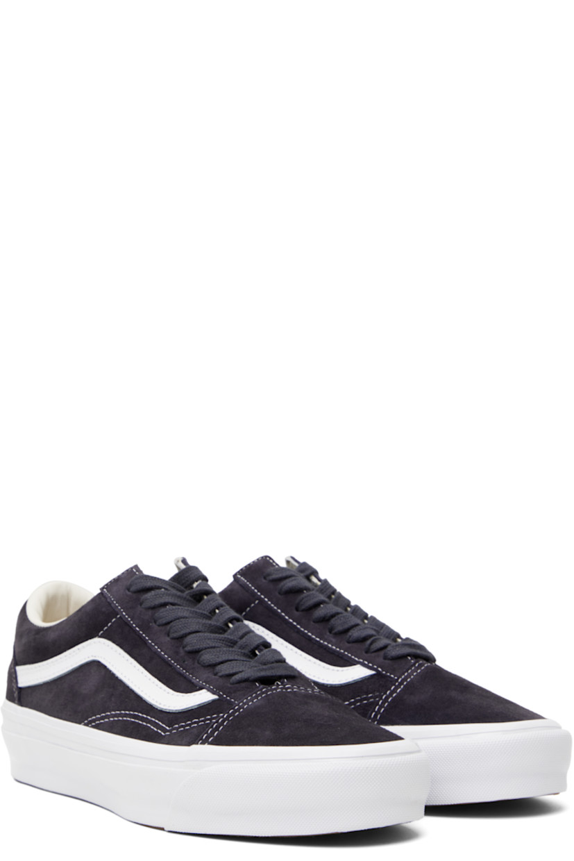 Low-top pigskin suede sneakers in navy.

· Lace-up closure
· Padded tongue and collar
· Grained leather Sidestripe™ at sides
· Rubberized logo patch at heel
· Grained leather and canvas lining
· Removable padded foam insole
· Treaded rubber sole
· Contrast stitching in white

Supplier color: Pig suede nine iron