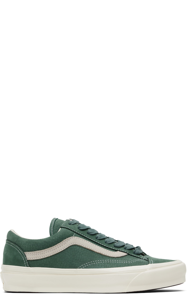 Low-top grained nubuck sneakers in green.

· Lace-up closure
· Padded tongue and collar
· Buffed leather Sidestripe™ at sides
· Rubberized logo patch at heel
· Removable padded foam insole
· Treaded rubber sole
· Contrast stitching in white

Supplier color: Le marais forest